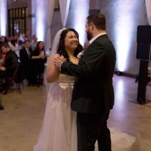 Wedding DJ booth setup with custom lighting